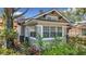 A detailed exterior view reveals brick accents and lush landscaping around the property at 231 15Th Ne Ave, St Petersburg, FL 33704