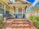 Welcoming front porch with brick steps, outdoor seating, and decorative accents at 231 15Th Ne Ave, St Petersburg, FL 33704