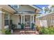Inviting front porch with brick steps and stylish decorations, providing a warm welcome at 231 15Th Ne Ave, St Petersburg, FL 33704