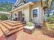 Inviting front porch with brick steps, seating, and manicured landscaping at 231 15Th Ne Ave, St Petersburg, FL 33704
