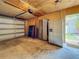 Spacious garage interior featuring stainless steel refrigerators and an open doorway to the backyard at 231 15Th Ne Ave, St Petersburg, FL 33704
