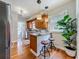 Kitchen featuring a breakfast bar, pendant lights, and beautiful hardwood floors at 231 15Th Ne Ave, St Petersburg, FL 33704