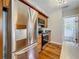 Kitchen with stainless steel appliances, oak cabinetry, and hardwood floors at 231 15Th Ne Ave, St Petersburg, FL 33704