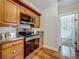 Kitchen showcasing stainless steel appliances, wooden cabinets, and hardwood floors at 231 15Th Ne Ave, St Petersburg, FL 33704