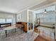 Bright living room with hardwood floors, comfortable seating, and access to an additional room at 231 15Th Ne Ave, St Petersburg, FL 33704