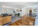 Spacious living room with hardwood floors, fireplace, and access to the dining area at 231 15Th Ne Ave, St Petersburg, FL 33704