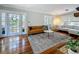 Bright living room with hardwood floors, classic furniture, and double glass doors at 231 15Th Ne Ave, St Petersburg, FL 33704
