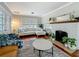 Cozy living room featuring a white brick fireplace and comfortable seating arrangement at 231 15Th Ne Ave, St Petersburg, FL 33704