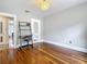 This home office features hardwood floors and a ladder-style desk at 231 15Th Ne Ave, St Petersburg, FL 33704