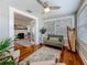 Sunroom showcases hardwood floors, ample light, a small sofa, and an ornate harp at 231 15Th Ne Ave, St Petersburg, FL 33704