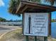 Sign announcing Anclote Lighthouse is open for climbing, inviting tourists to explore a historical landmark on weekends at 2349 Wood Pointe Dr, Holiday, FL 34691