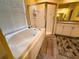 Bathroom with large soaking tub, shower, and ample counter space at 2349 Wood Pointe Dr, Holiday, FL 34691