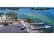 Elevated view of a community boat launch with multiple docks, offering convenient access to the water for boating and fishing at 2349 Wood Pointe Dr, Holiday, FL 34691