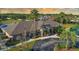 Beautiful community clubhouse surrounded by lush landscaping, creating a serene atmosphere at 2349 Wood Pointe Dr, Holiday, FL 34691