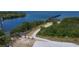 Path to waterfront park featuring access to pier, bench, and preserved natural beauty at 2349 Wood Pointe Dr, Holiday, FL 34691