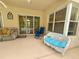 Comfortable outdoor patio setting with cozy seating and relaxing ambiance, providing a perfect spot for leisure and outdoor living at 2349 Wood Pointe Dr, Holiday, FL 34691
