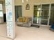 Relaxing outdoor patio area with comfortable seating, overlooking the pool, and offering an ideal space for entertaining and leisure at 2349 Wood Pointe Dr, Holiday, FL 34691