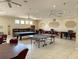 Large recreation room with a billiards table, ping pong table, and computer stations at 2349 Wood Pointe Dr, Holiday, FL 34691