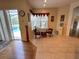 Cozy sitting area with tiled floor, two chairs, a table, and a view of the pool through sliding glass doors at 2349 Wood Pointe Dr, Holiday, FL 34691