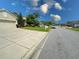 Charming home showcasing a well-kept lawn and inviting curb appeal on a sunny day at 2349 Wood Pointe Dr, Holiday, FL 34691
