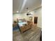Comfortable bedroom with ceiling fan, wood furniture set, and door to bathroom at 2390 Bentley Dr, Palm Harbor, FL 34684