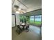 Relaxing enclosed lanai with outdoor seating and view of the backyard at 2390 Bentley Dr, Palm Harbor, FL 34684