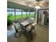 Enclosed lanai with seating, ideal for outdoor relaxation and entertaining at 2390 Bentley Dr, Palm Harbor, FL 34684
