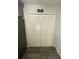 Bright laundry area with large louvered closet doors and a laundry themed sign at 2390 Bentley Dr, Palm Harbor, FL 34684