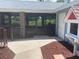 Enclosed patio featuring a mix of brick and wood, offering a relaxing outdoor living space at 2390 Bentley Dr, Palm Harbor, FL 34684