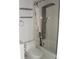 Bathroom featuring a standup shower and tub combination with modern fixtures at 2980 Haines Bayshore Rd # 124, Clearwater, FL 33760