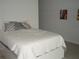 Bedroom featuring neutral decor and flooring with a full-sized bed at 2980 Haines Bayshore Rd # 124, Clearwater, FL 33760