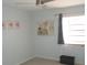 Bedroom featuring neutral decor and flooring and window with curtains at 2980 Haines Bayshore Rd # 124, Clearwater, FL 33760