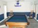 Spacious game room featuring a pool table, bar stools, and a decorative ceiling light at 2980 Haines Bayshore Rd # 124, Clearwater, FL 33760