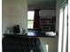 Compact kitchenette with microwave, oven, sink, and plenty of storage at 2980 Haines Bayshore Rd # 124, Clearwater, FL 33760