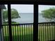 View from lanai of open green space and bridge over bay at 2980 Haines Bayshore Rd # 124, Clearwater, FL 33760