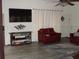 Comfortable living room with modern flooring, a flat-screen TV and nice decor at 2980 Haines Bayshore Rd # 124, Clearwater, FL 33760