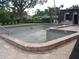 Large in-ground pool with brick paving and ladders ready for renovation at 2980 Haines Bayshore Rd # 124, Clearwater, FL 33760