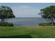 Scenic water view of the bridge in the distance from a well-maintained lawn at 2980 Haines Bayshore Rd # 124, Clearwater, FL 33760