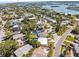 Overhead view capturing the house within a vibrant waterfront community at 306 12Th Ave, Indian Rocks Beach, FL 33785