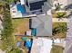 Aerial view of the house showcasing the roof, yard, and neighborhood at 306 12Th Ave, Indian Rocks Beach, FL 33785