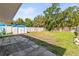 Large backyard featuring a storage shed and partial privacy fence at 306 12Th Ave, Indian Rocks Beach, FL 33785