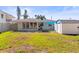 Backyard with a storage shed and partially shady lawn at 306 12Th Ave, Indian Rocks Beach, FL 33785