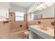 Pink bathroom with a vanity sink, tile floors, a shower and a tub at 306 12Th Ave, Indian Rocks Beach, FL 33785