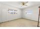 Bedroom with tile floors, two windows, and a ceiling fan at 306 12Th Ave, Indian Rocks Beach, FL 33785