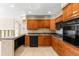 Kitchen featuring granite countertops, stainless steel appliances and wood cabinets at 306 12Th Ave, Indian Rocks Beach, FL 33785