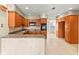 Kitchen featuring granite countertops, tile floors and wood cabinets at 306 12Th Ave, Indian Rocks Beach, FL 33785
