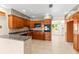 Bright kitchen featuring granite countertops, wood cabinets and stainless steel appliances at 306 12Th Ave, Indian Rocks Beach, FL 33785