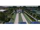 Aerial view of bocce ball courts, surrounded by palm trees, shade structures, lush landscaping and community amenities at 3198 Malta Ave, Wesley Chapel, FL 33543