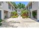Charming courtyard view of a beautifully landscaped home exterior at 3205 W De Leon St # F, Tampa, FL 33609