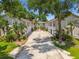 Exterior view of modern apartments with green foliage, highlighting the balanced, symmetrical design at 3205 W De Leon St # F, Tampa, FL 33609